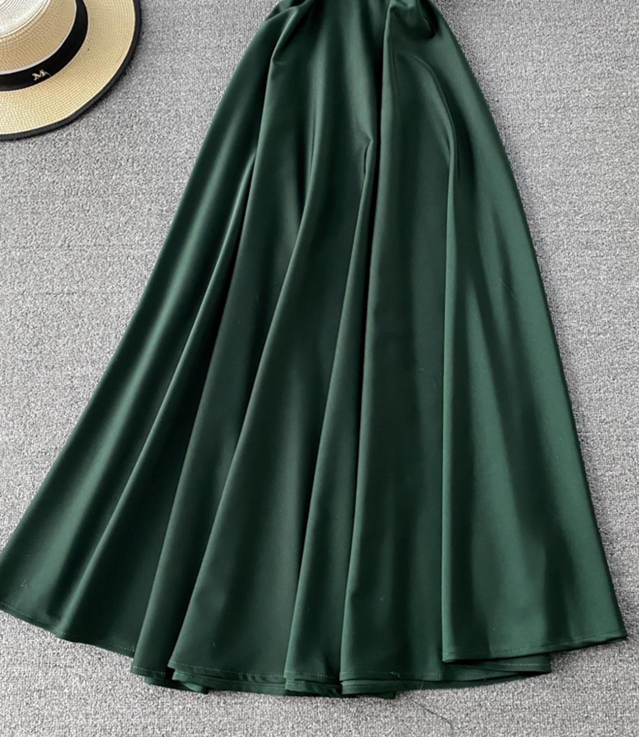 detail of green satin a-line maxi skirt