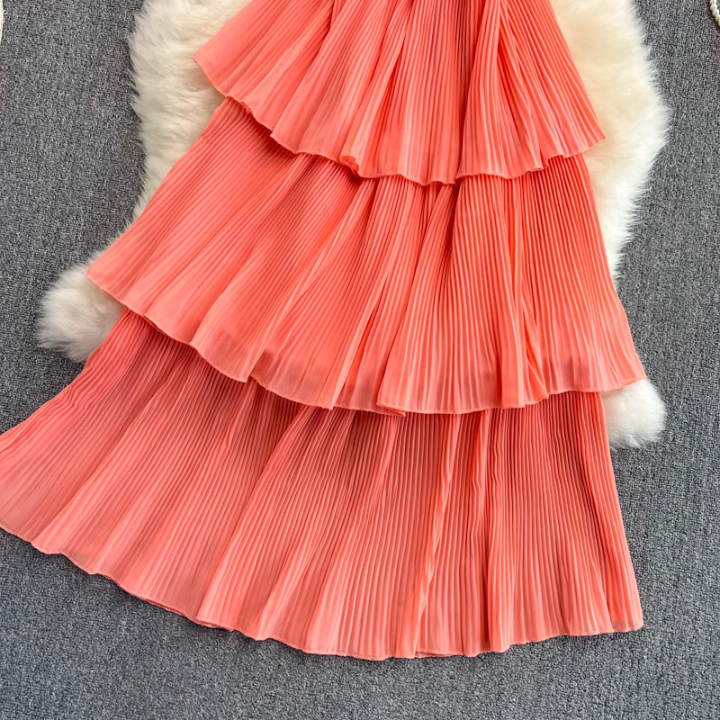 Close-up of coral tiered ruffled skirt