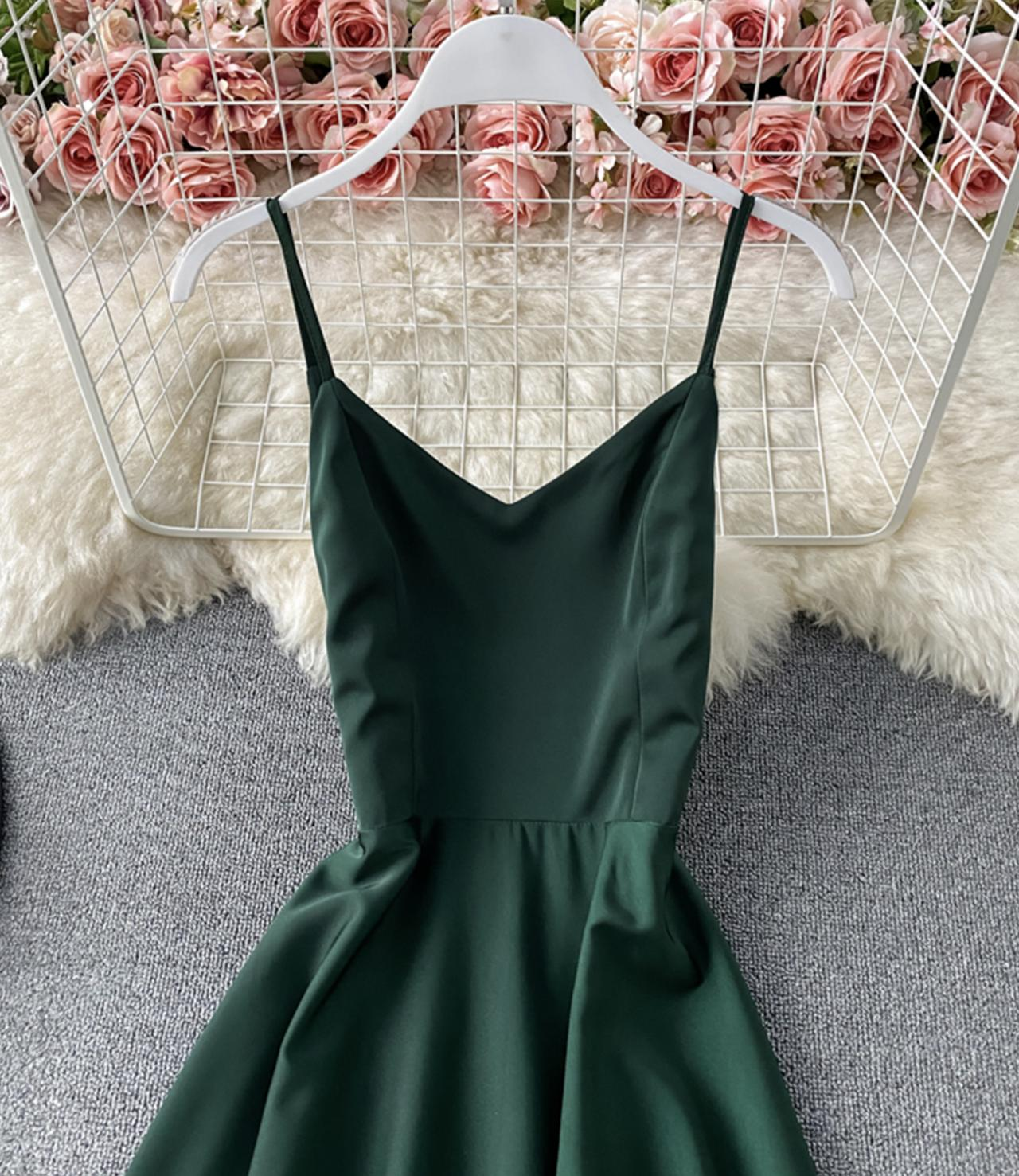 close-up of green satin spaghetti strap v-neck bodice