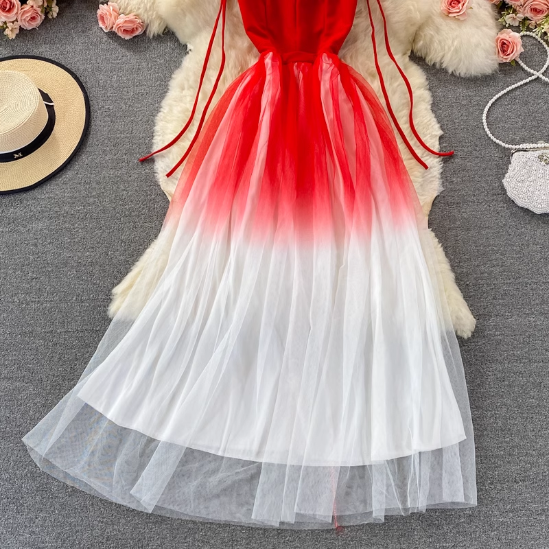 Detail of the gradient tulle skirt on a red and white dress