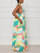 side view of a woman in a halter neck maxi dress