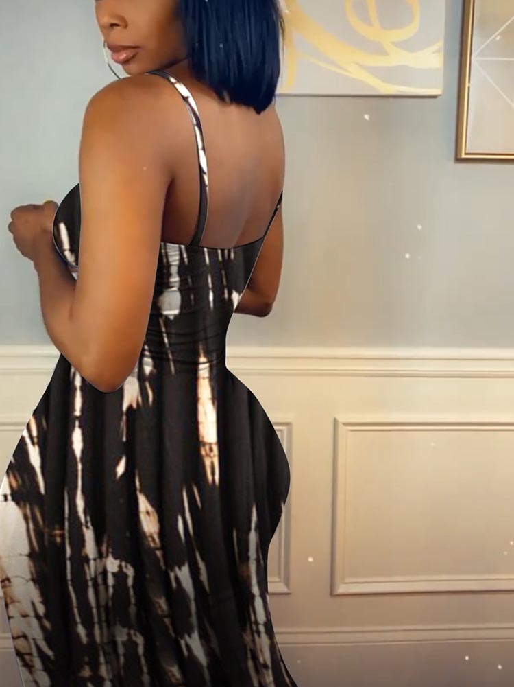 Woman in a black and white tie-dye midi dress, back view.