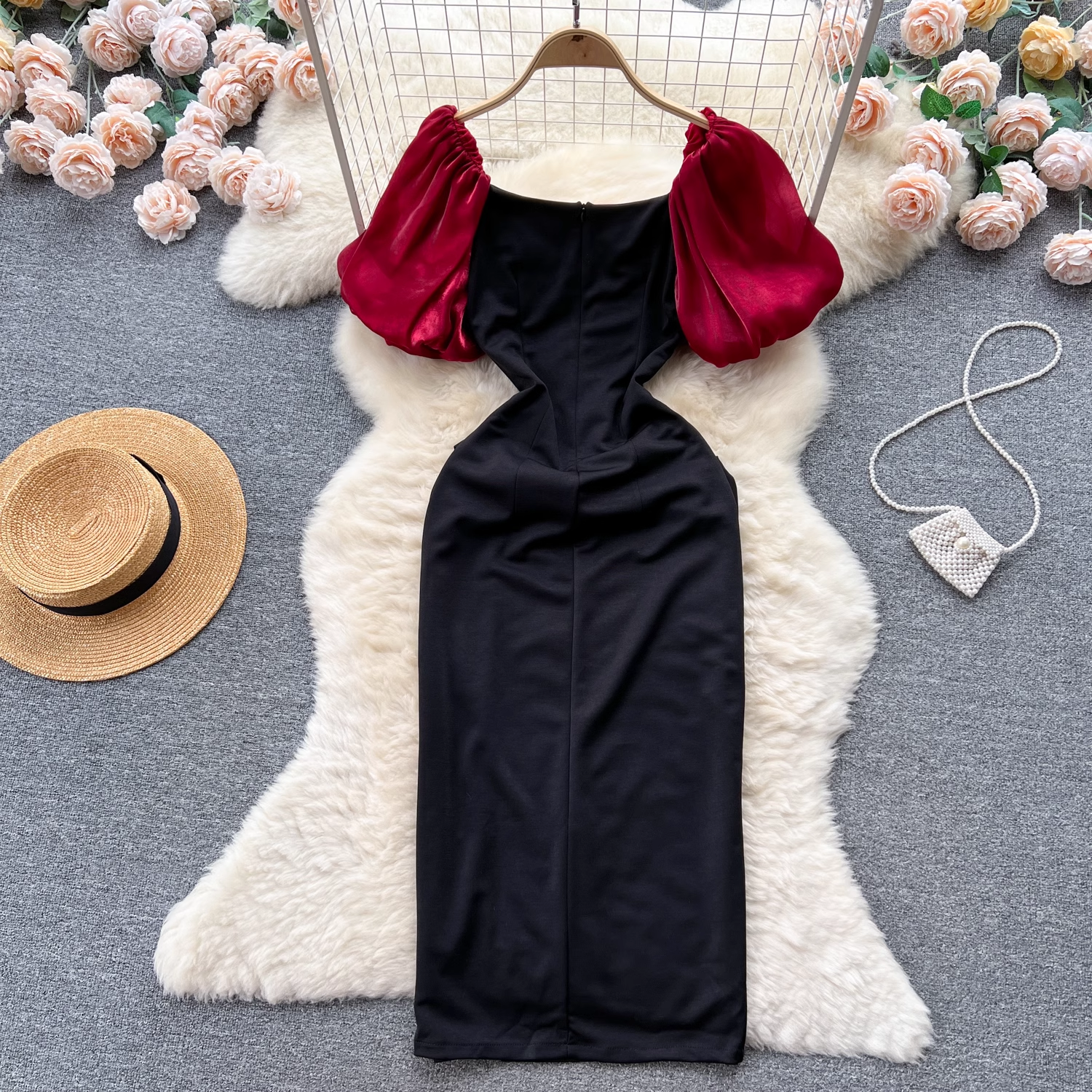 Black and red puff sleeve dress laid flat