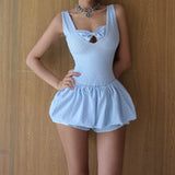 Close-up of the light blue romper with a bow detail and ruched skirt.