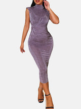 Woman wearing a purple velvet ruched bodycon dress with a high neck and sleeveless design.