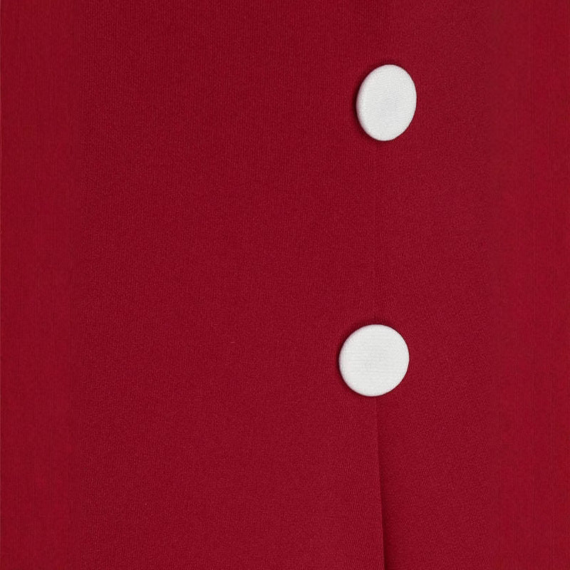 close-up of white decorative buttons on a red dress