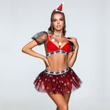 Woman in a festive two-piece outfit with a plaid trim and snowflake details