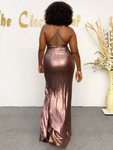 Back view of a woman in a metallic evening gown with a low back.