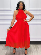 Woman in a red pleated halter dress