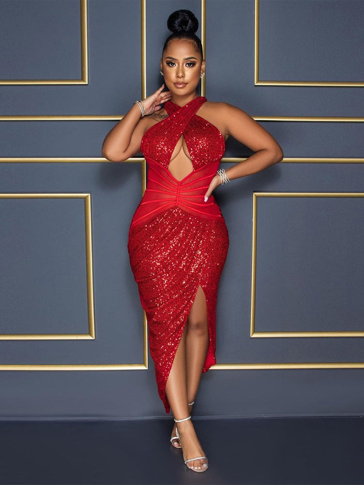 Woman wearing a red sequined halter dress with a plunging neckline and high slit.