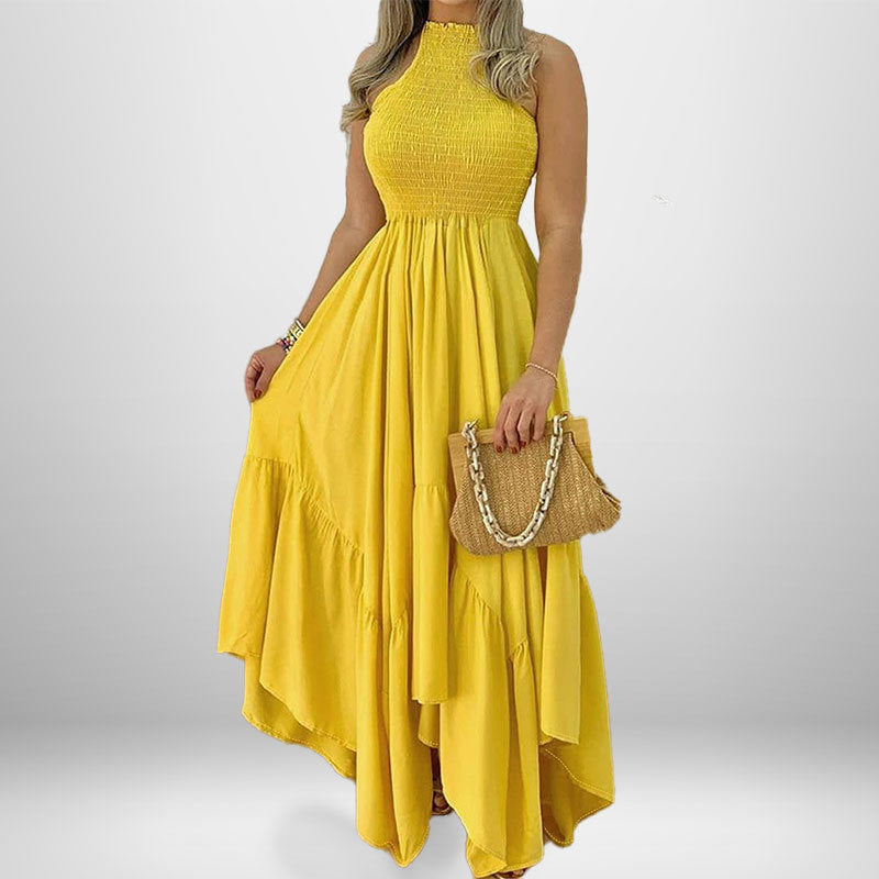 woman in yellow halter neck maxi dress with ruffled tiers and smocked bodice