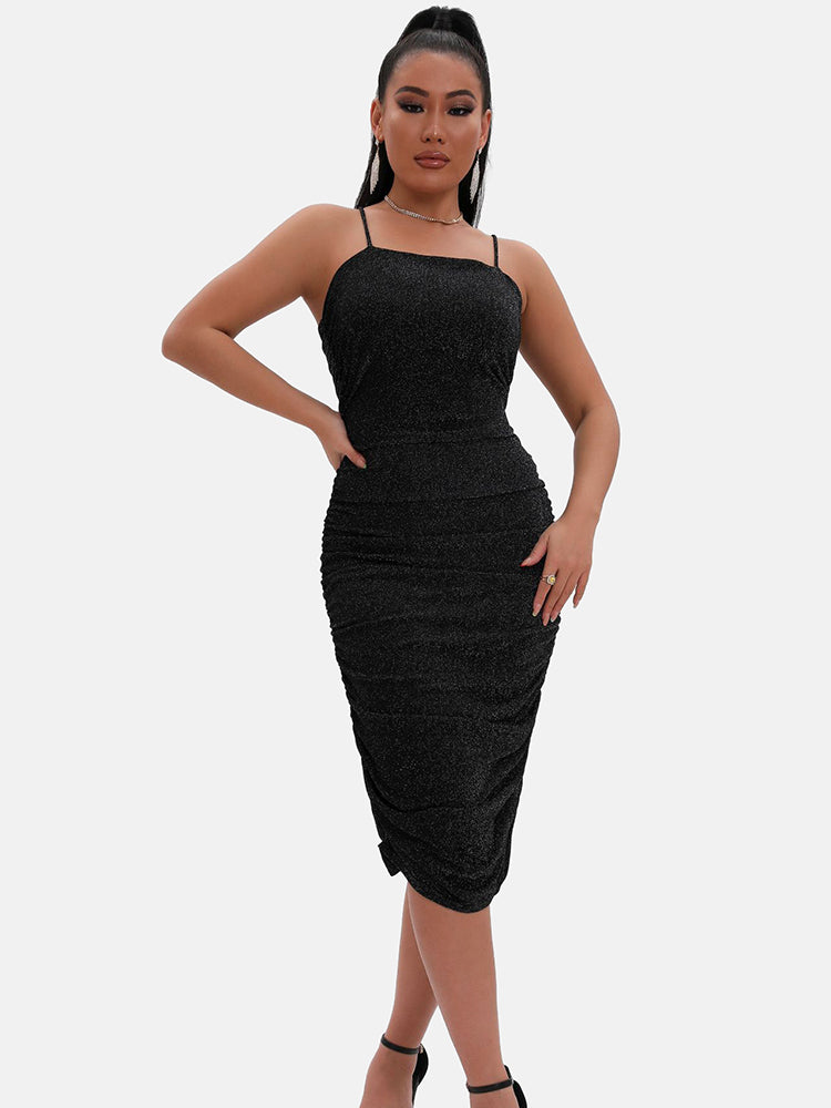 model wearing a black shimmering ruched midi dress with spaghetti straps