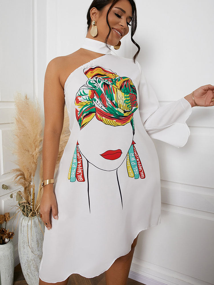 Woman wearing a white one-shoulder dress with a graphic print of a woman's face