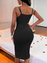 Back view of a woman in a black bodycon midi dress.