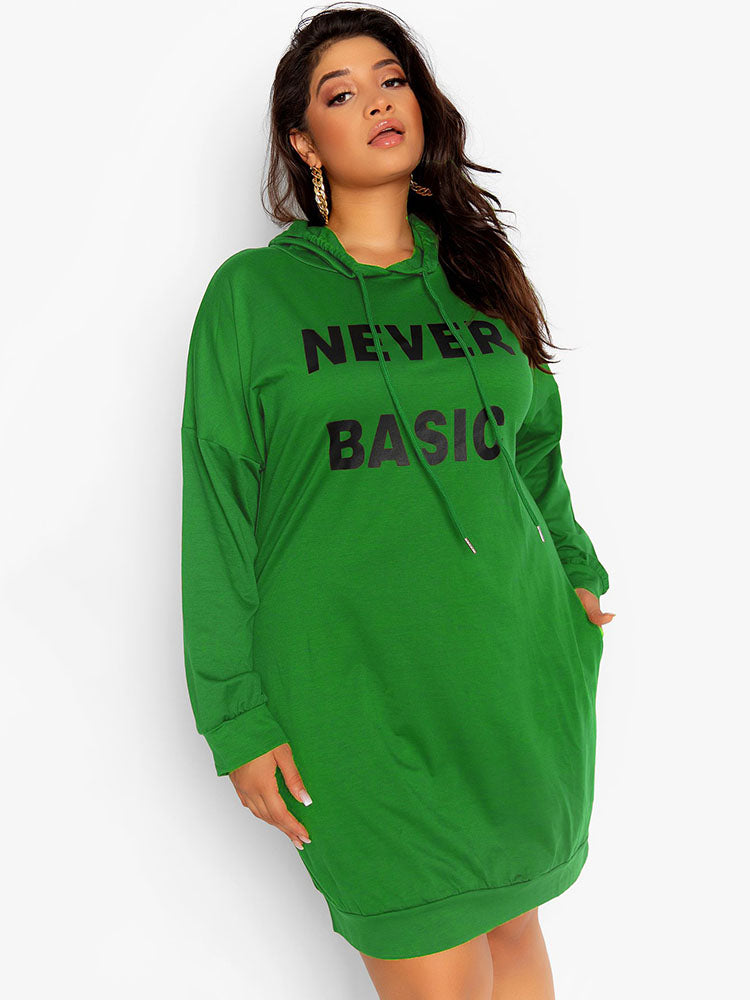 Plus size green hoodie dress with "NEVER BASIC" graphic print