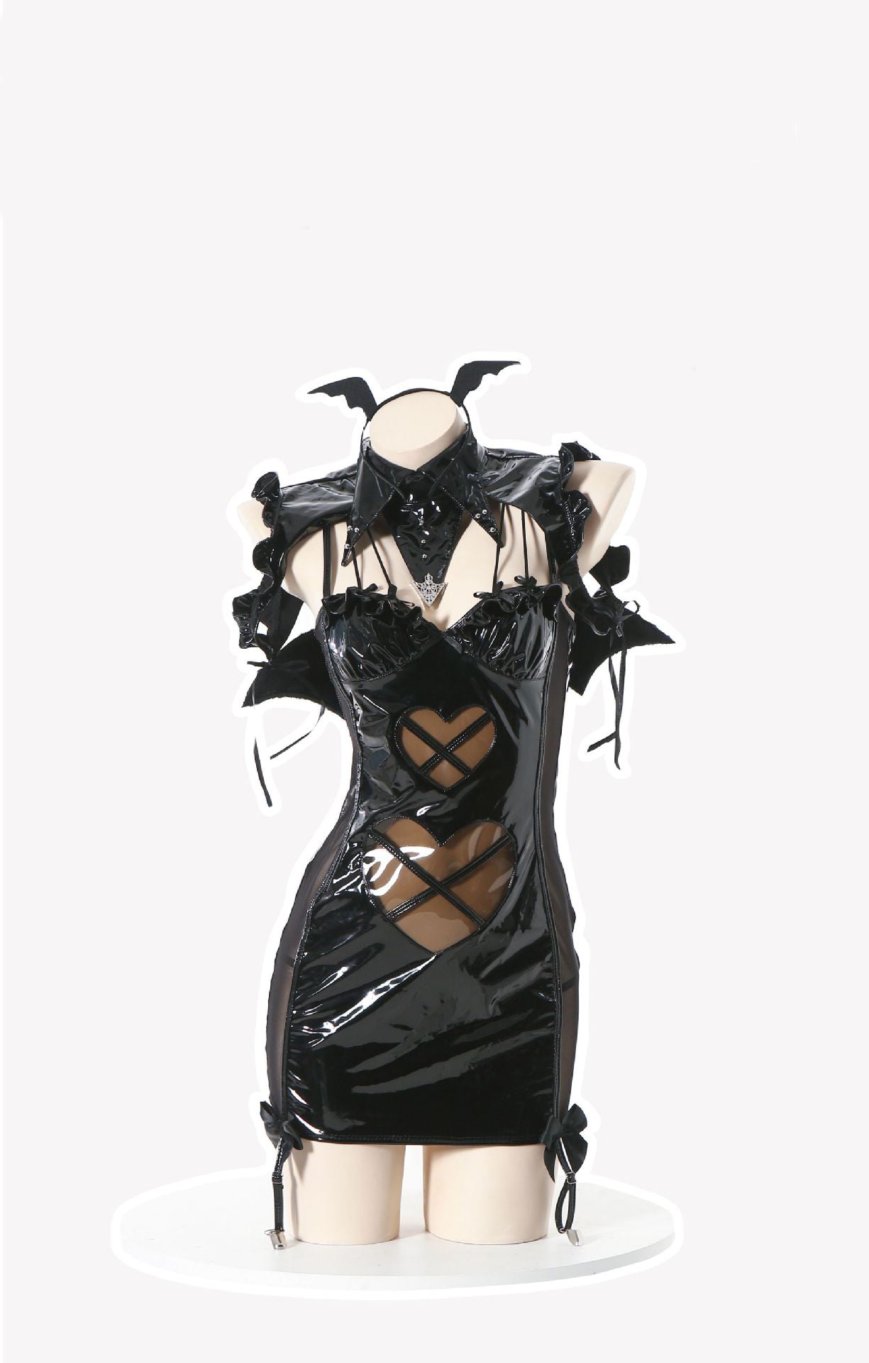 Black patent mini dress with harness detail, cut-outs, bows, and bat ear headband.