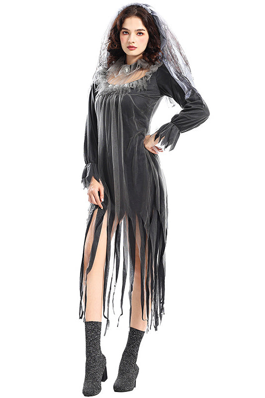 Side view of a woman in a dark, tattered gown with a veil, showcasing the silhouette and details of the costume.