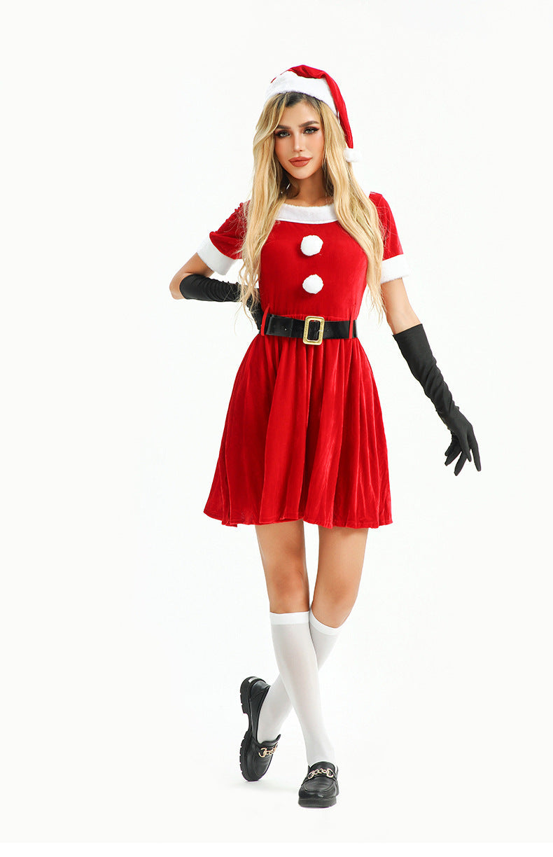 Full-body view of a woman in a Christmas-themed outfit, including a red dress and Santa hat.