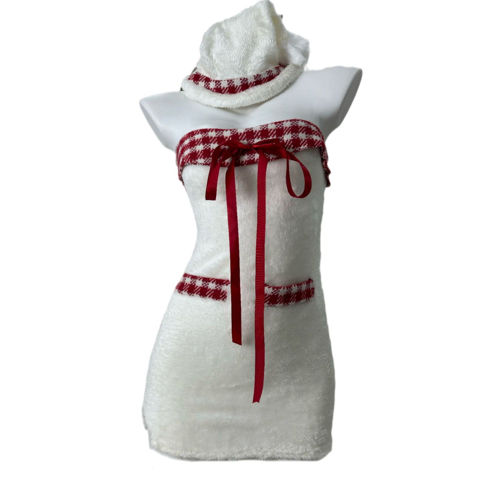 Front view of a white strapless dress with red plaid trim and red ribbon accents, displayed on a mannequin with a matching hat.