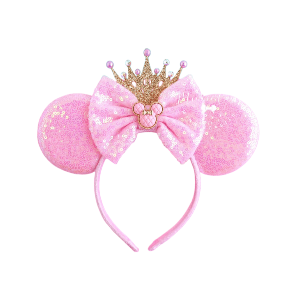 Pink sequin Minnie Mouse ears headband with a gold crown and pink bow