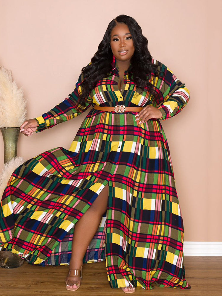 Woman showing the slit of a colorful plaid maxi dress