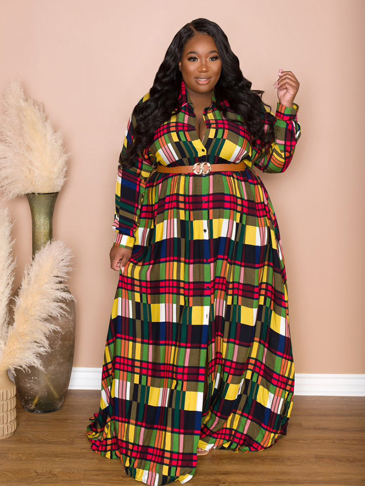 Woman posing in a colorful plaid maxi dress