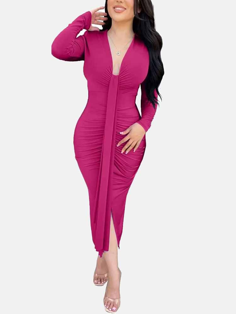 Woman wearing a long-sleeved pink ruched dress with a deep V-neckline and a tie-front detail.