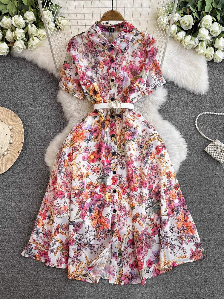 A floral print midi dress with a collared neckline and short sleeves, belted at the waist.