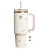 Stanley 40oz insulated tumbler featuring celestial star pattern, gold accents, hanging star charm, and cream ergonomic handle