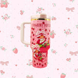 Stanley 40oz insulated tumbler featuring Strawberry Shortcake artwork, pink strawberry pattern, white handle and floral background
