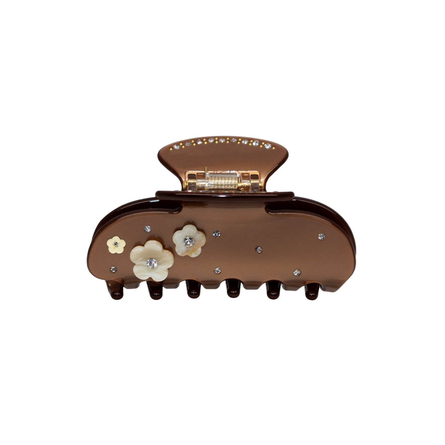 A brown plastic claw clip with flower embellishments and rhinestones.