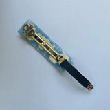 A close-up of the metal clasp on the barrette.