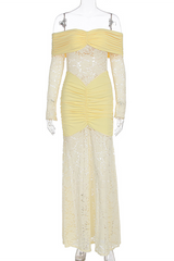 A pale yellow off-the-shoulder formal dress with long lace sleeves and ruched detailing displayed on a mannequin.