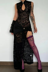 Model wearing a black lace gown with a ruched waist detail and a high slit.