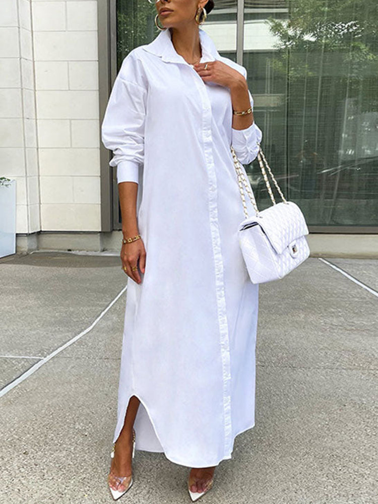 Woman wearing a long white button-down shirt dress with clear high heels