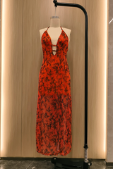 orange floral print maxi dress displayed on a mannequin