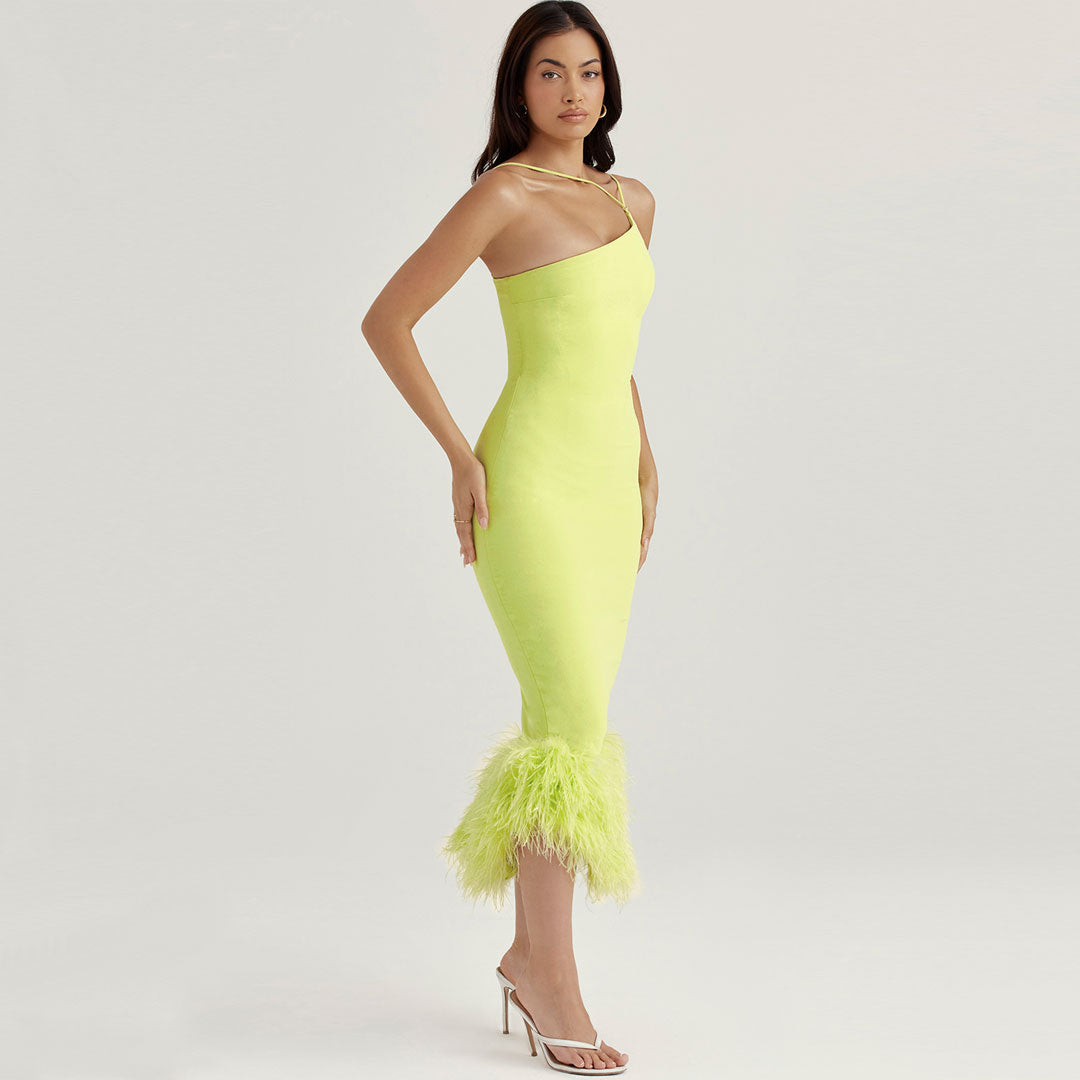 side view of a woman wearing a lime green feather-trimmed dress