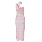 back view of a pink floral print satin slip dress with a high slit