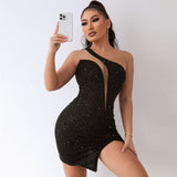 Woman in a black one-shoulder sequined mini dress with a thigh-high slit, holding a smartphone.