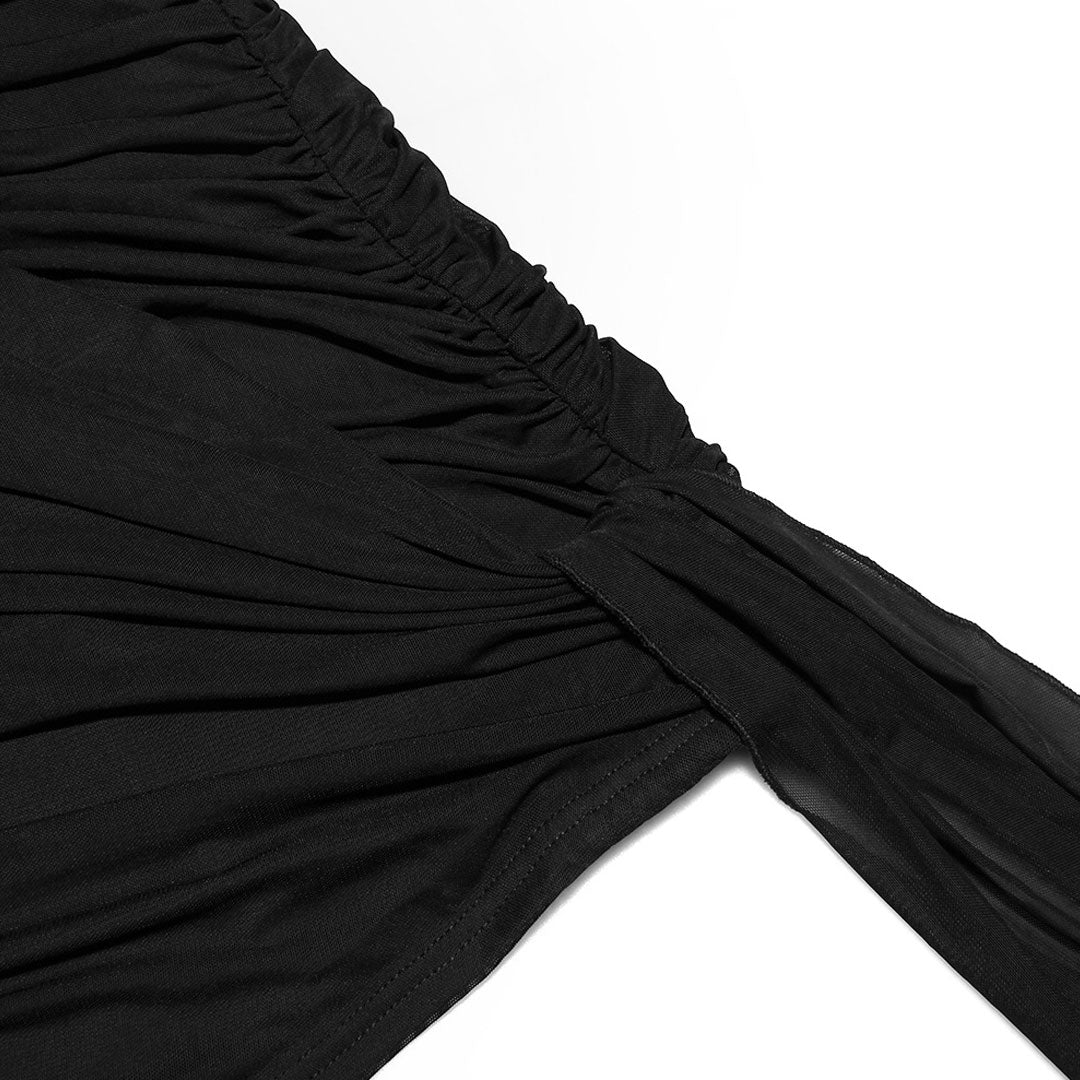 Close-up of the ruched detailing on the black mini dress.