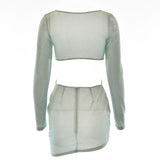 back view of a light blue sparkling long-sleeve mini dress with cut-out details and asymmetrical hem
