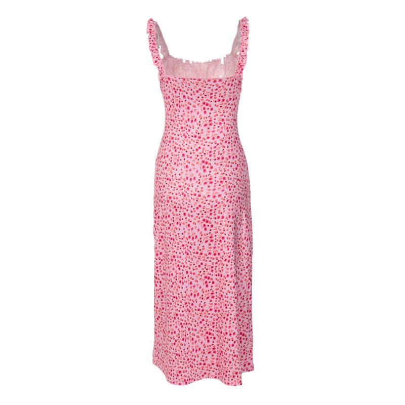 Back view of a pink floral print midi dress with spaghetti straps and a sweetheart neckline.