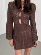 woman wearing a brown crochet knit mini dress with long bell sleeves and a keyhole neckline