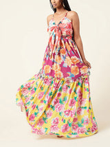 Front view of a woman in a vibrant floral maxi dress.