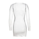 Back view of a white long-sleeve bodycon mini dress with black graphic print details.