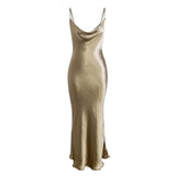 Gold satin slip dress laid flat against a white background