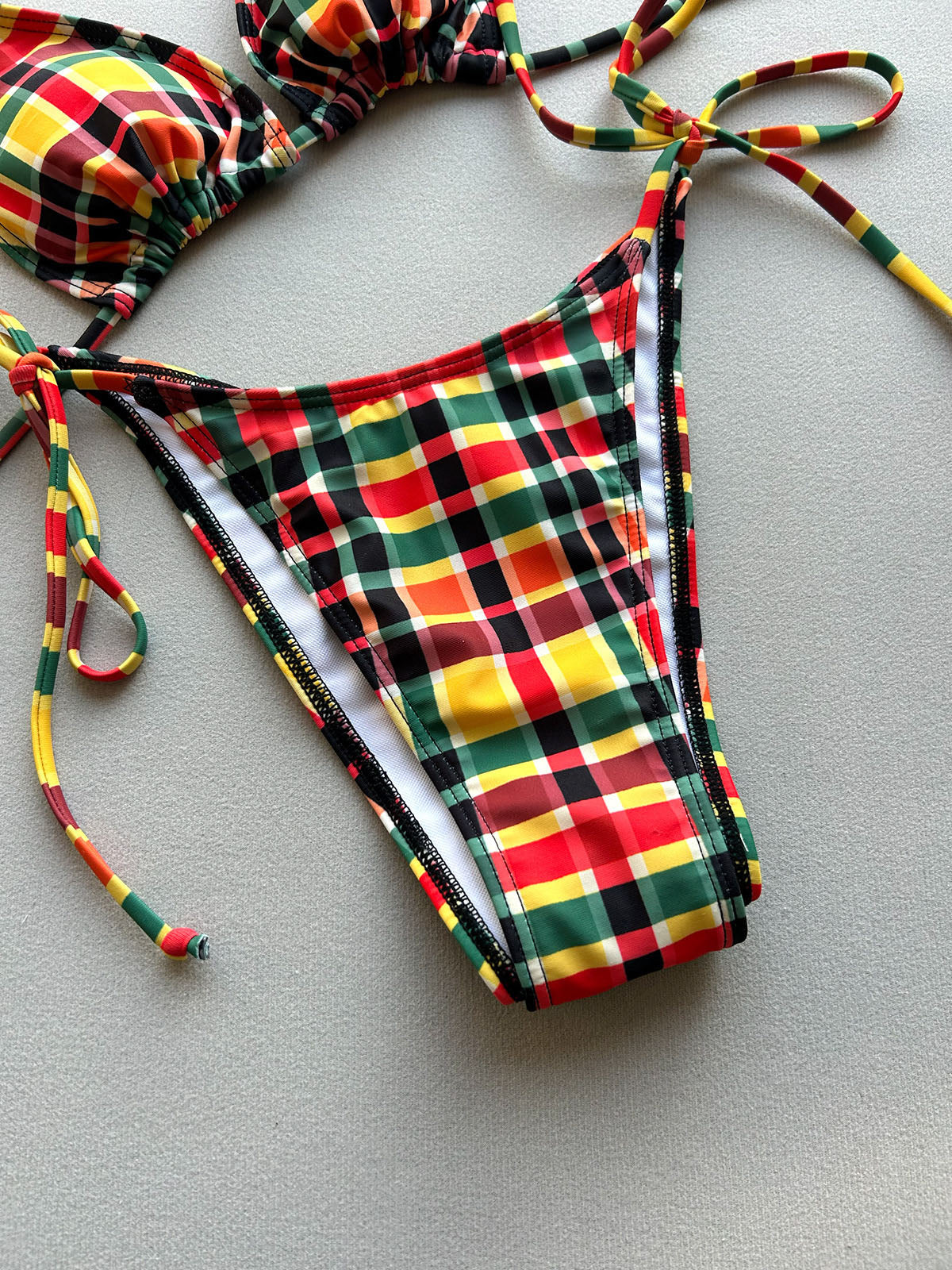 Close-up of the tartan plaid bikini bottom with adjustable side ties