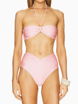 Front view of a pink strapless bikini with a halter strap and pearl detail.