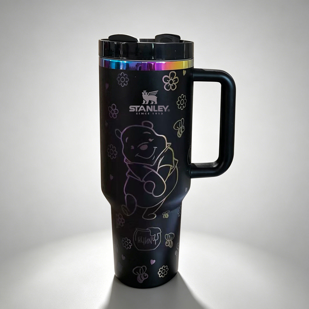Stanley 40oz insulated tumbler featuring cute black bear illustrations, paw prints and floral accents