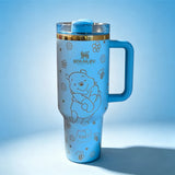 Stanley 40oz insulated tumbler featuring cute blue bear illustrations, paw prints and floral accents